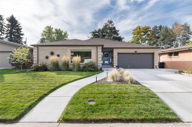 ranch-style home featuring a front lawn and a garage