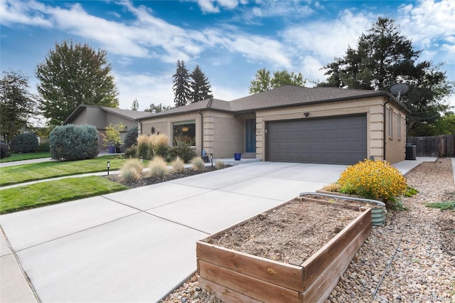 ranch-style home featuring a garage and a front lawn