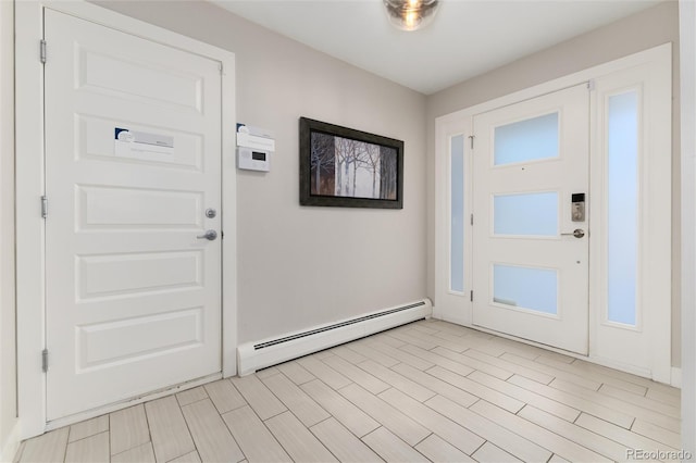 foyer entrance featuring a baseboard radiator