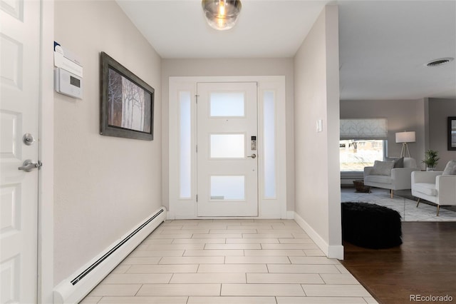 entryway featuring baseboard heating