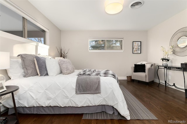 bedroom featuring dark wood-type flooring