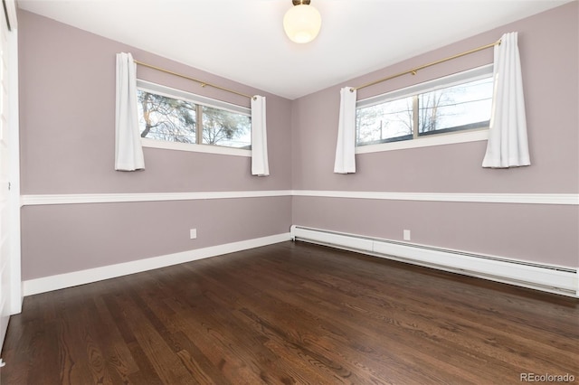 unfurnished room with a baseboard radiator, dark hardwood / wood-style flooring, and plenty of natural light