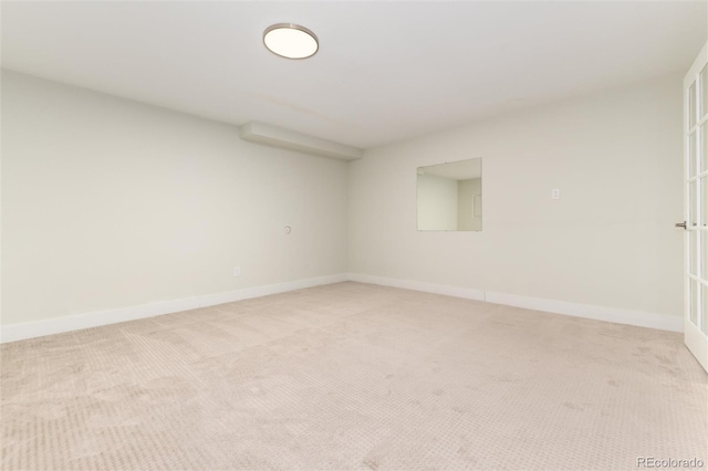 empty room with light colored carpet