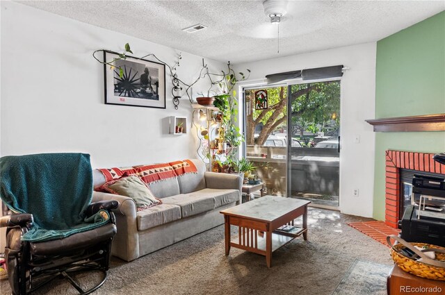 carpeted living room featuring a textured ceiling