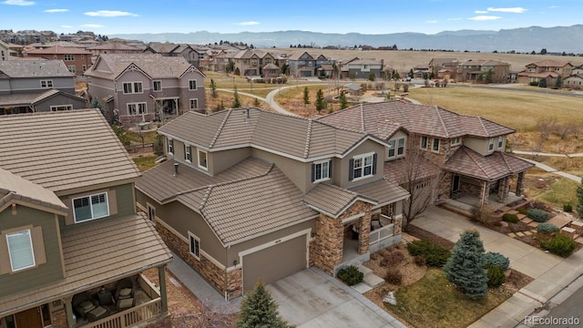 bird's eye view featuring a residential view and a mountain view