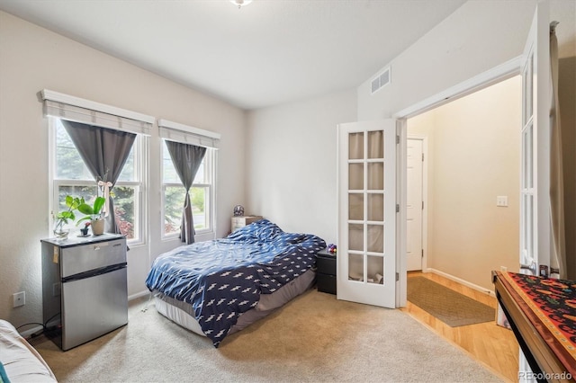 21063 E Greenwood Pl, Aurora, CO 80013 - bedroom with french doors, baseboards, and carpet