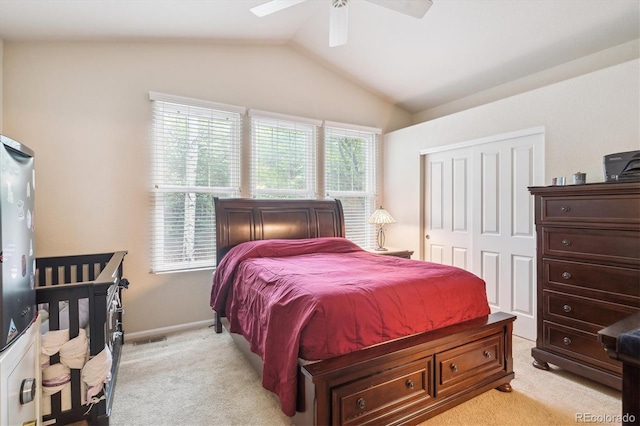 21063 E Greenwood Pl, Aurora, CO 80013 - bedroom featuring light carpet, vaulted ceiling, a closet, a ceiling fan, and baseboards