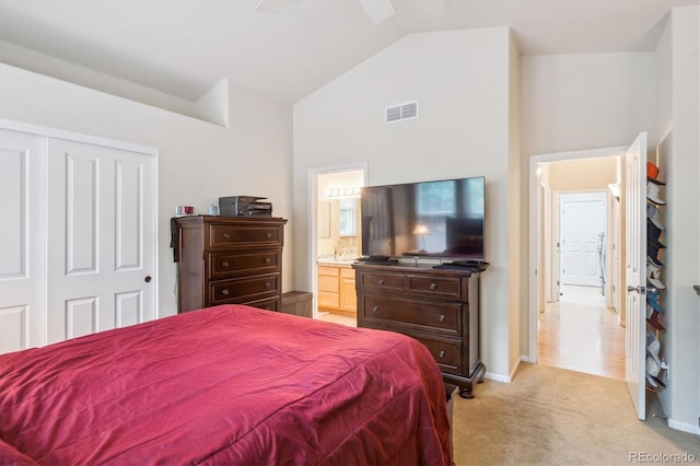 21063 E Greenwood Pl, Aurora, CO 80013 - bedroom with lofted ceiling, light carpet, a closet, baseboards, and ensuite bath