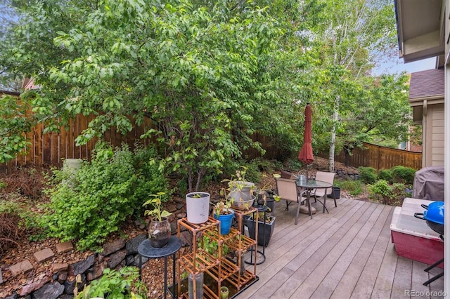 21063 E Greenwood Pl, Aurora, CO 80013 - wooden terrace with a fenced backyard, outdoor dining space, and grilling area