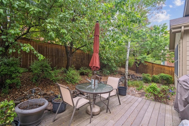 21063 E Greenwood Pl, Aurora, CO 80013 - wooden terrace with a fenced backyard and outdoor dining area