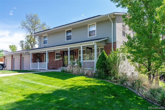 6150 Reed St, Arvada, CO 80003 - view of front of house featuring a porch, a garage, a front yard, and brick siding
