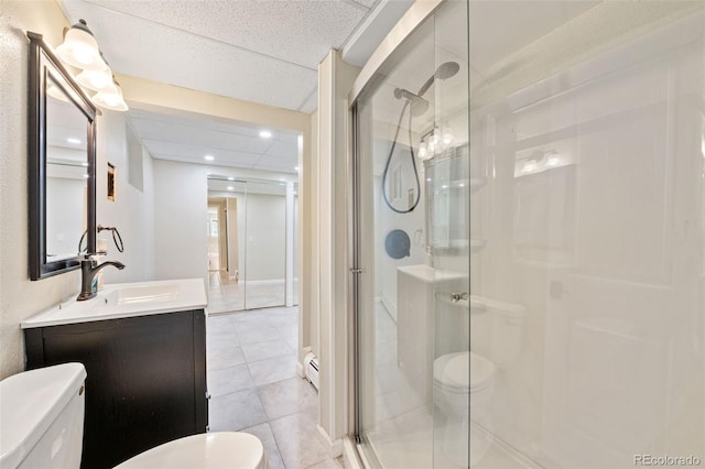 6150 Reed St, Arvada, CO 80003 - bathroom with toilet, a shower stall, vanity, tile patterned flooring, and recessed lighting