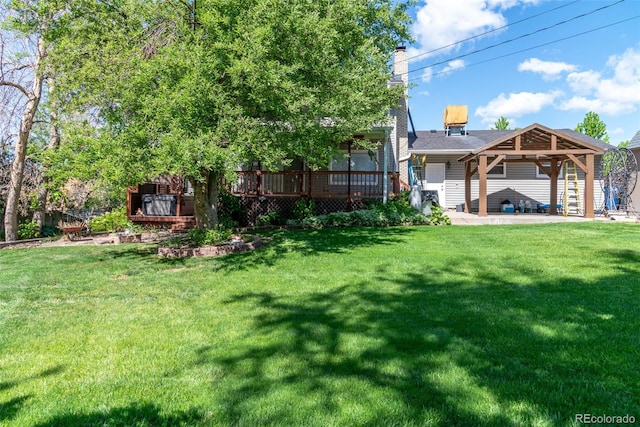 6150 Reed St, Arvada, CO 80003 - view of grassy yard with a wooden deck, a patio area, and a gazebo