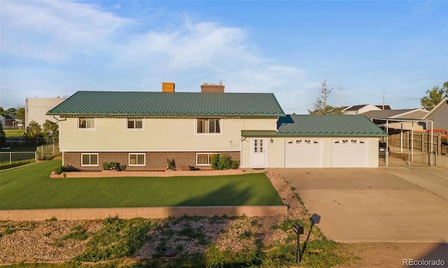 view of front of house featuring a garage, concrete driveway, metal roof, and a chimney