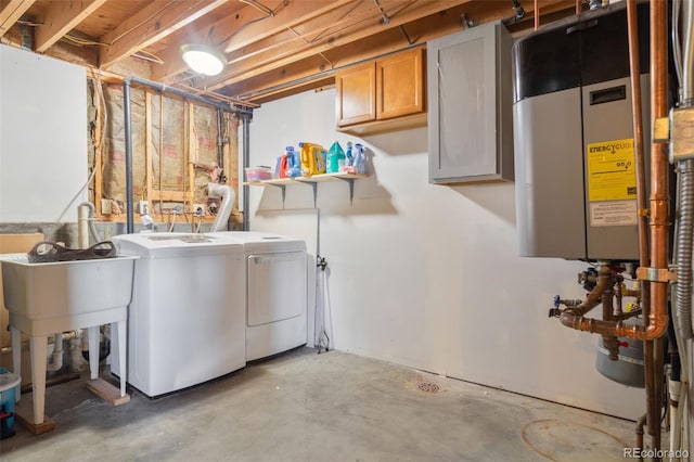 washroom featuring cabinet space and independent washer and dryer