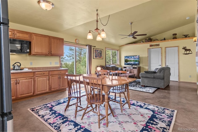 dining area with ceiling fan with notable chandelier and vaulted ceiling