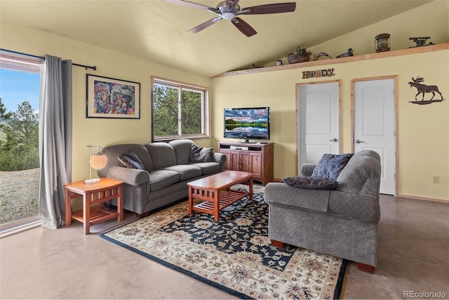 living room with a healthy amount of sunlight, concrete floors, ceiling fan, and lofted ceiling