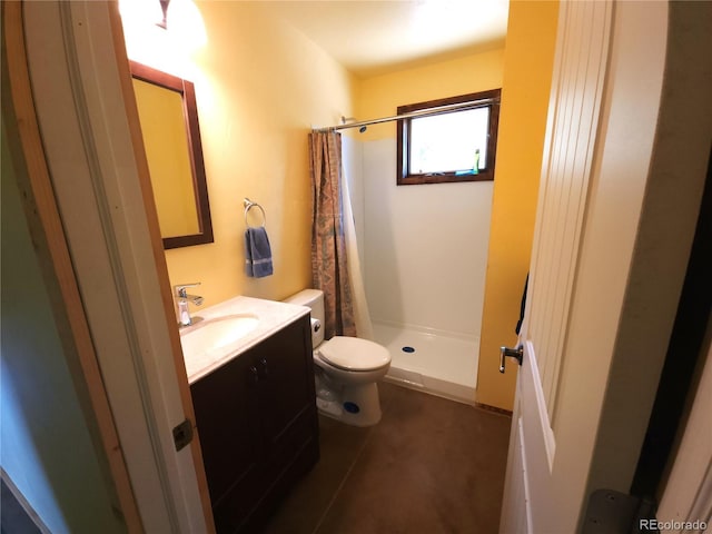 bathroom with tile patterned floors, curtained shower, vanity, and toilet