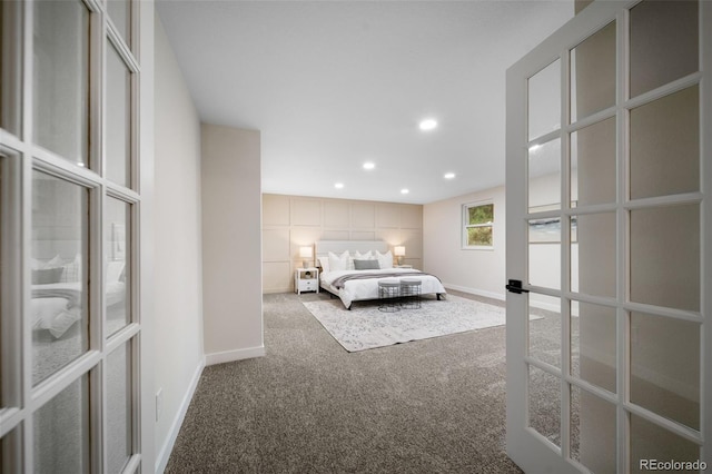 unfurnished bedroom with french doors and carpet