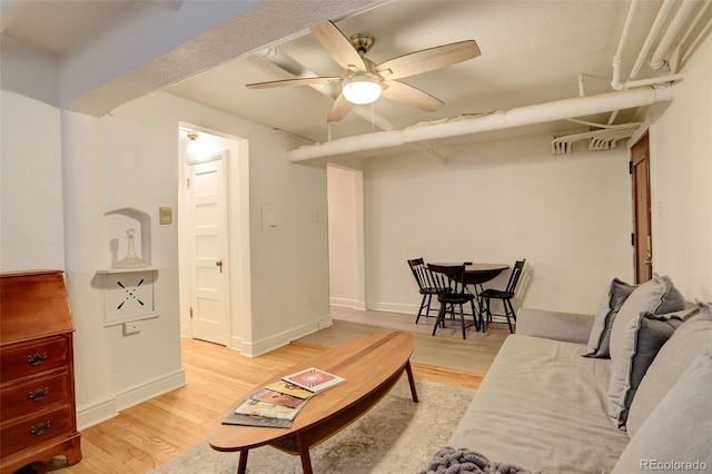 1060 N Washington St Unit 1A, Denver, CO 80203 - living area featuring light wood-style floors and a ceiling fan