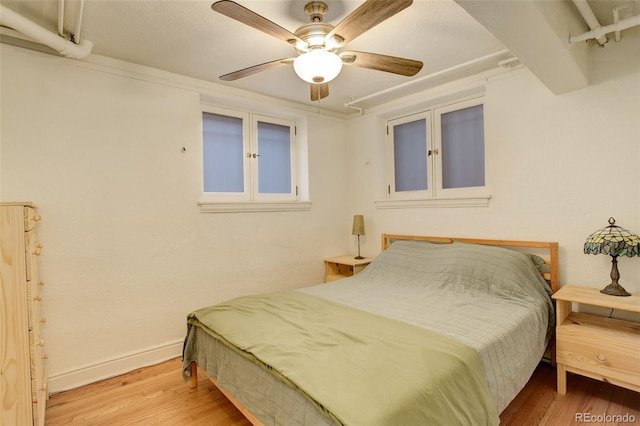 1060 N Washington St Unit 1A, Denver, CO 80203 - bedroom with wood finished floors and a ceiling fan