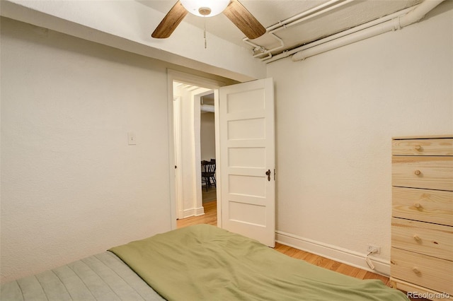 1060 N Washington St Unit 1A, Denver, CO 80203 - bedroom with light wood-type flooring and a ceiling fan