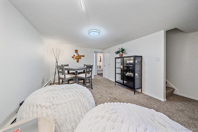 bedroom with carpet, baseboards, and a baseboard radiator