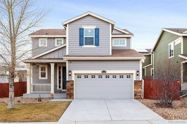 craftsman-style home with a porch and a garage