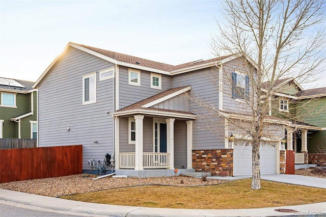 view of front of house featuring a garage and covered porch