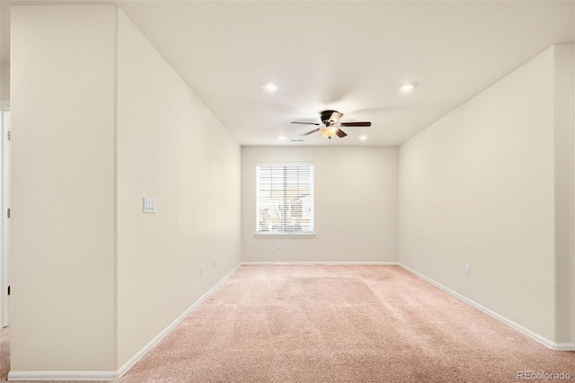 carpeted empty room featuring ceiling fan