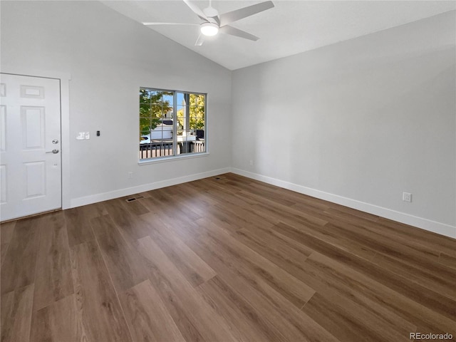 empty room featuring lofted ceiling, ceiling fan, and hardwood / wood-style flooring