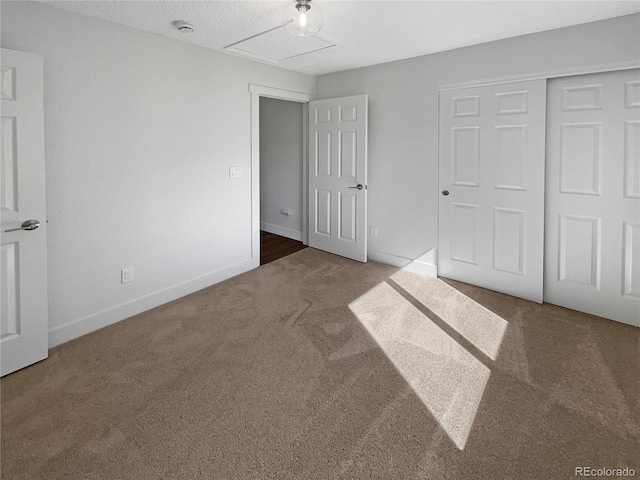 unfurnished bedroom featuring a closet and carpet flooring