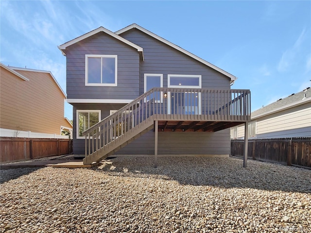 back of house featuring a deck