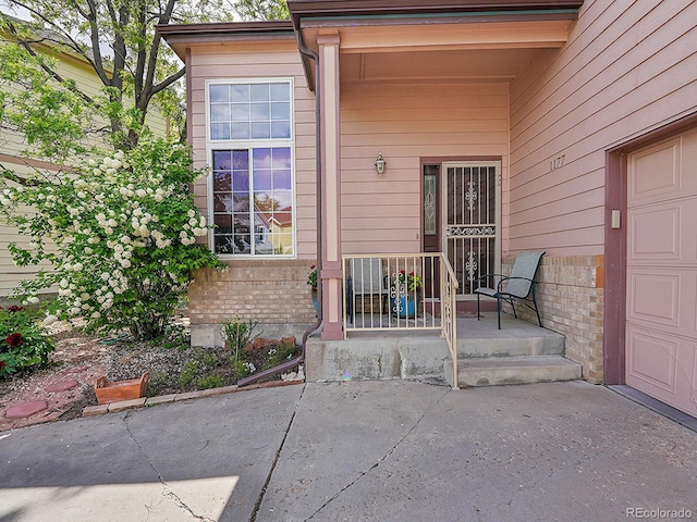 property entrance with a garage