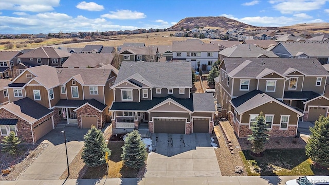 drone / aerial view with a mountain view and a residential view