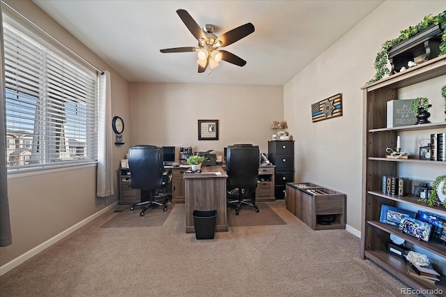 office featuring carpet flooring, a ceiling fan, and baseboards