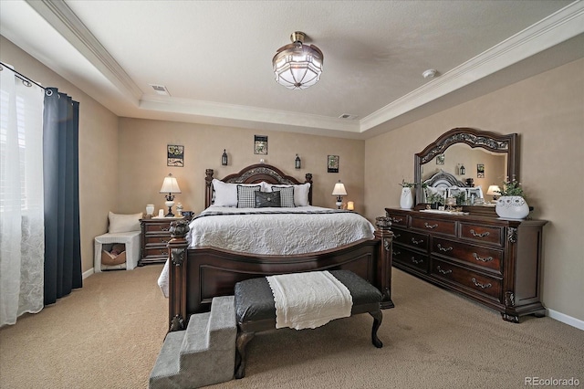 bedroom featuring a tray ceiling, light colored carpet, visible vents, and baseboards