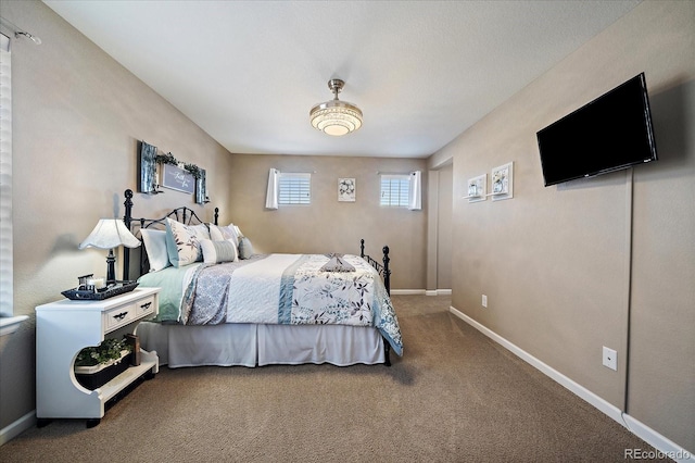 carpeted bedroom with baseboards