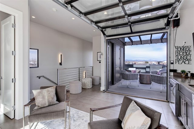 2442 Champa St, Denver, CO 80205 - living room with light tile patterned floors, recessed lighting, and beverage cooler