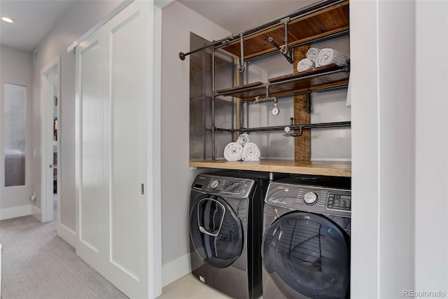 2442 Champa St, Denver, CO 80205 - laundry room featuring washer and dryer, baseboards, and light colored carpet