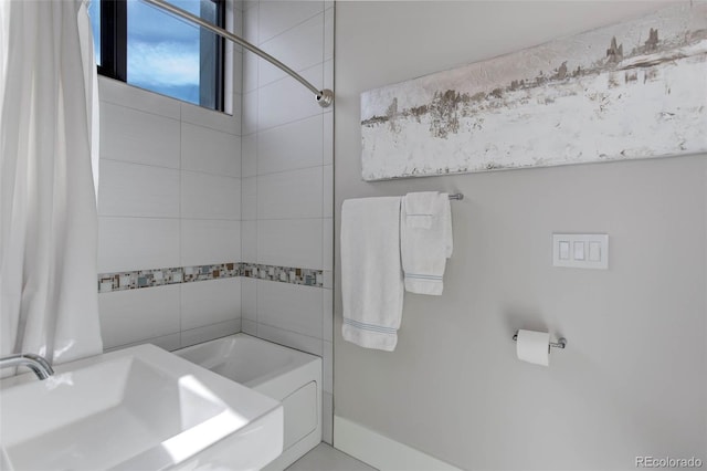 2442 Champa St, Denver, CO 80205 - full bathroom featuring a sink and shower / washtub combination