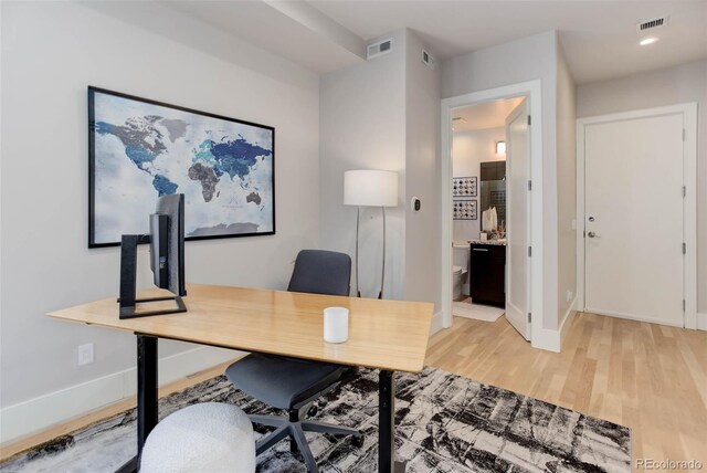 2442 Champa St, Denver, CO 80205 - home office with light wood-type flooring and baseboards