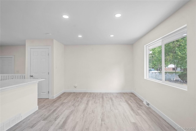 empty room with light wood-type flooring