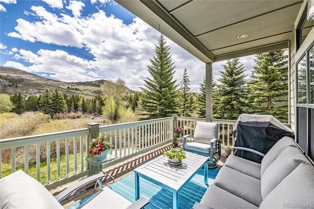 133 Creek Ln, Silverthorne, CO 80498 - wooden deck with a mountain view, a grill, and outdoor lounge area