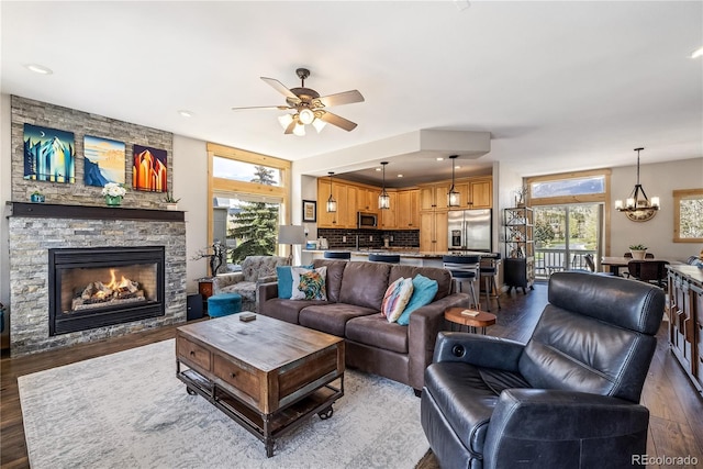 133 Creek Ln, Silverthorne, CO 80498 - living area with dark wood-style floors, a ceiling fan, and healthy amount of natural light