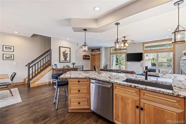 133 Creek Ln, Silverthorne, CO 80498 - kitchen featuring stainless steel dishwasher, dark wood finished floors, ceiling fan, light stone counters, and recessed lighting