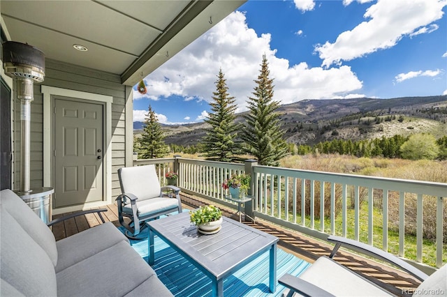 133 Creek Ln, Silverthorne, CO 80498 - deck featuring a mountain view and an outdoor hangout area