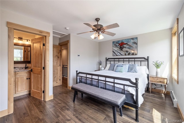133 Creek Ln, Silverthorne, CO 80498 - bedroom with a baseboard radiator, dark wood-style floors, and ceiling fan