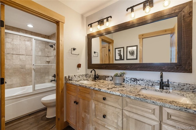 133 Creek Ln, Silverthorne, CO 80498 - bathroom with double vanity, wood finished floors, and combined bath / shower with glass door