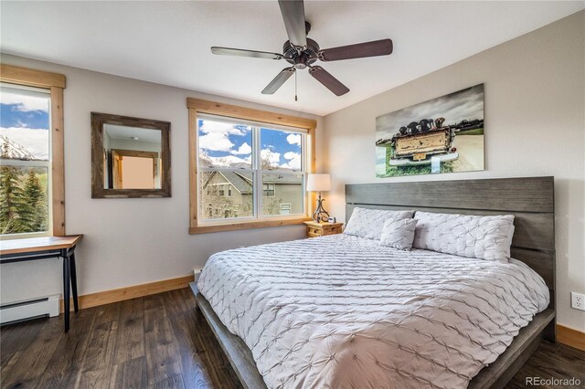 133 Creek Ln, Silverthorne, CO 80498 - bedroom featuring baseboard heating, wood finished floors, and ceiling fan